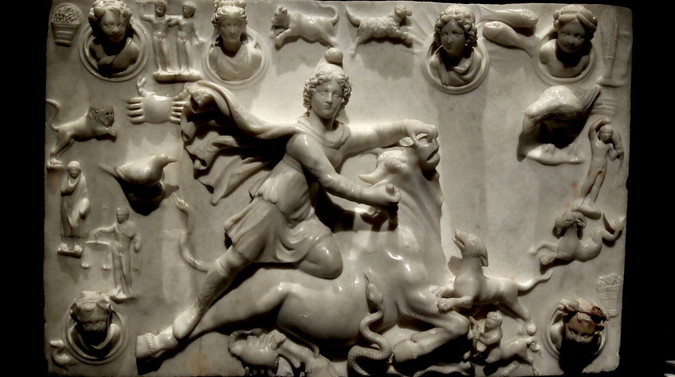 Roman marble relief of the god Mithras slaying the bull, encircled by the twelve signs of the zodiac — a cosmic ruler set within the wheel of fate.